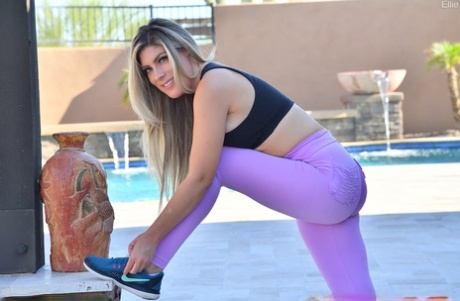 Dirty blonde Ellie dildos her pussy after stretching out in workout clothes - pornpics.de