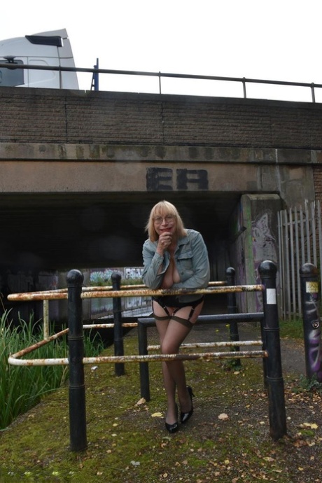 Older blonde Barby Slut flashes her tits and ass while out in public places