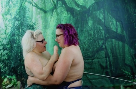 UK fatty Mollie Foxxx and her lesbian lover sport glasses during dildo play