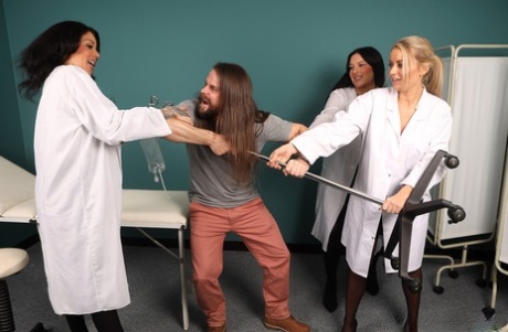 British women in lab coats subdue a patient with a bout of CFNM sex