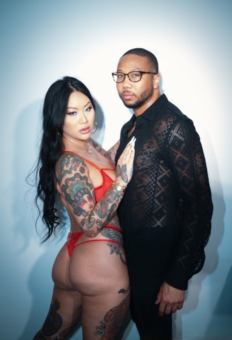 Tattooed Asian chick Connie Perignon has sex with her black lover