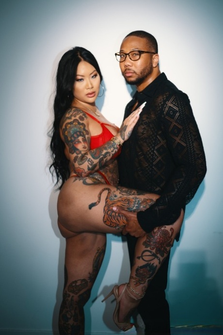 Tattooed Asian chick Connie Perignon has sex with her black lover