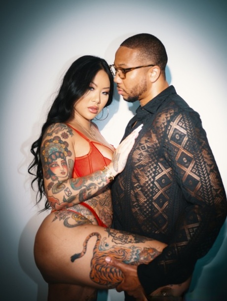 Tattooed Asian chick Connie Perignon has sex with her black lover