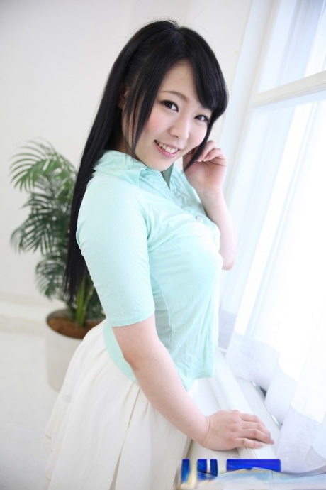 Adorable Japanese girl Yui Kawagoe poses by herself before having sex