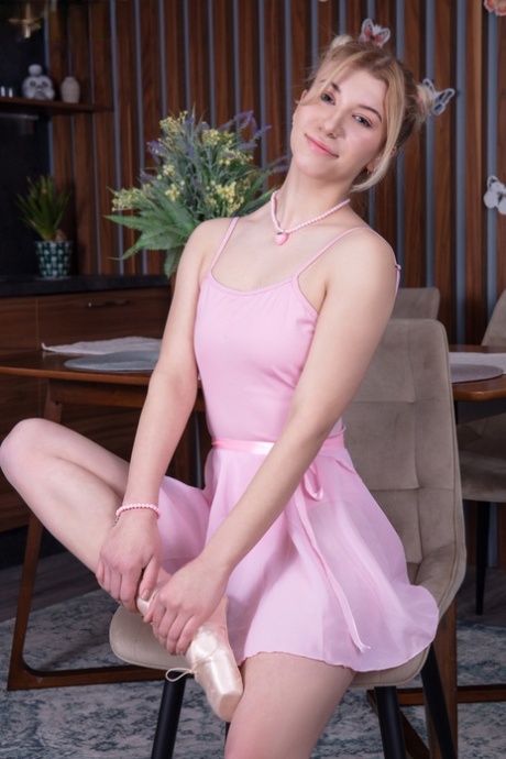 Sweet teen Peaches gets totally naked with her hair set into puffballs
