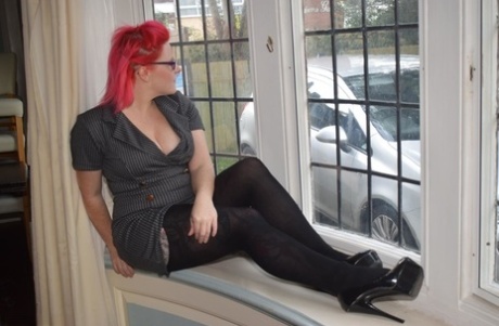 Thick middle-aged redhead strips to crotchless pantyhose during solo action