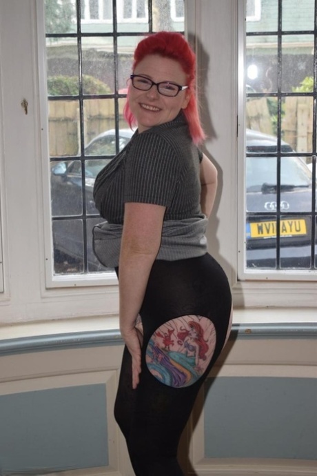 Thick middle-aged redhead strips to crotchless pantyhose during solo action