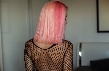 Stunning 18-year-old Kiara J sports pink hair while getting bare naked