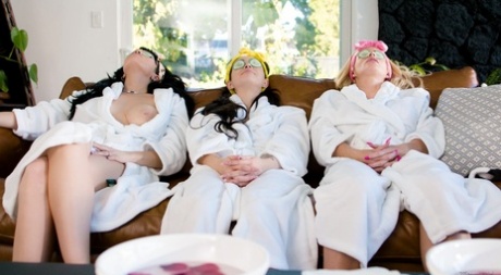 A spa day for three women in white robes suddenly evolves into a lesbian 3some