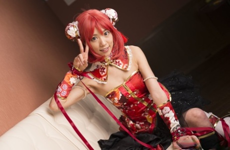 Charming Japanese cosplayer Satomi exposes her thong during upskirt play