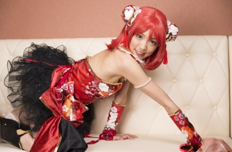 Charming Japanese cosplayer Satomi exposes her thong during upskirt play