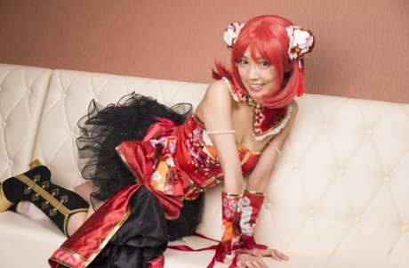 Charming Japanese cosplayer Satomi exposes her thong during upskirt play