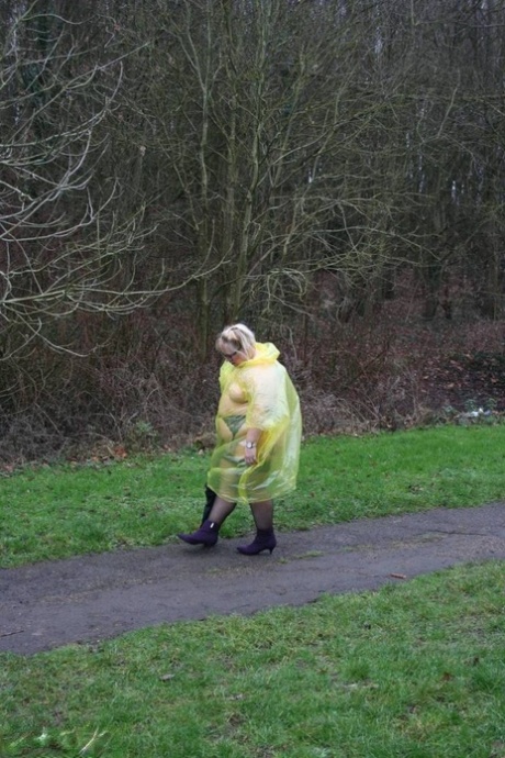 Obese British woman Lexie Cummings flashes at a park while sporting rain wear