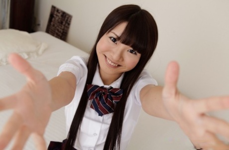 Japanese coed Natsuki Hasegawa unbuttons her blouse after showing her panties