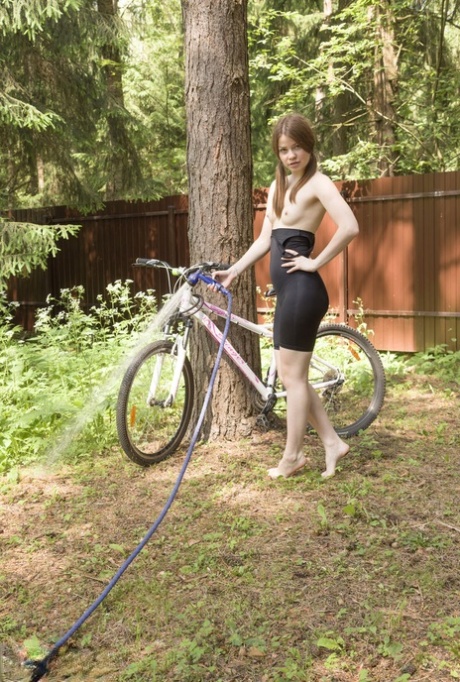 Nice teen Juny discard spandex athletic wear to get naked in a backyard