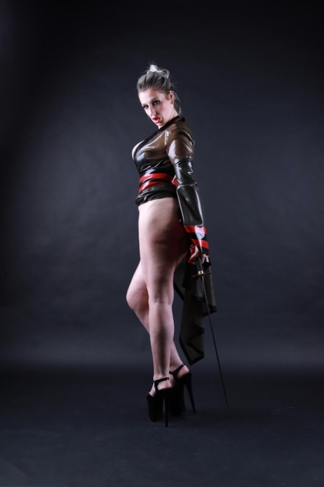 Platinum blonde model shows her great legs while outfitting cosplay apparel