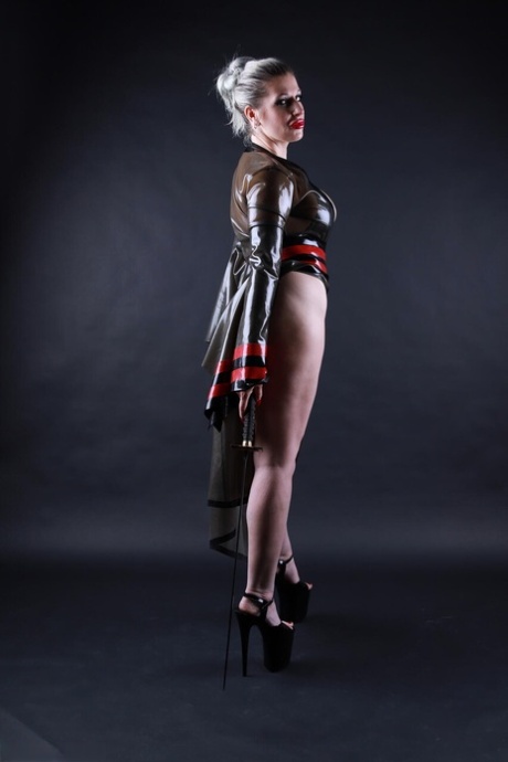 Platinum blonde model shows her great legs while outfitting cosplay apparel