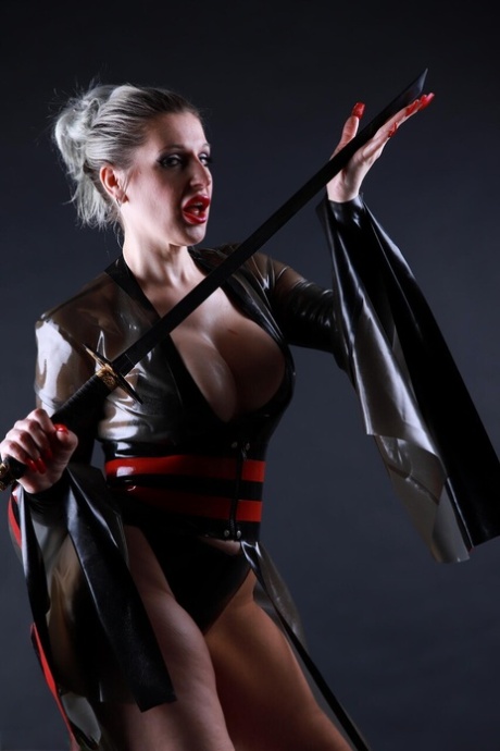 Platinum blonde model shows her great legs while outfitting cosplay apparel