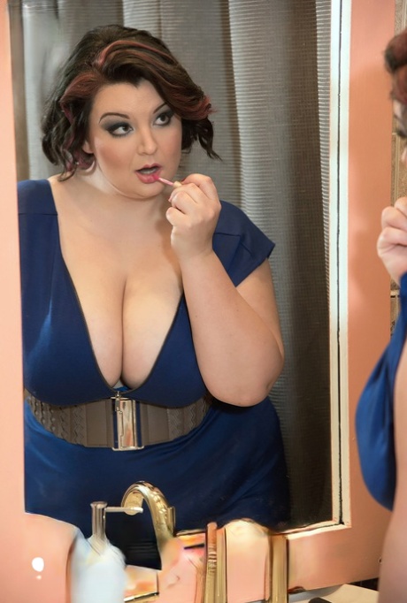 BBW Lucy Lenore unleashes her big boobs in the bathroom after doing her makeup