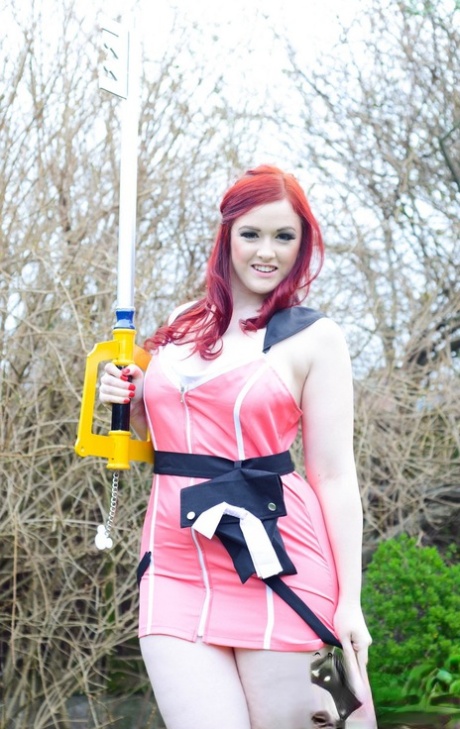 Thick redhead Jaye Rose exposes her tits and twat while attired in cosplay