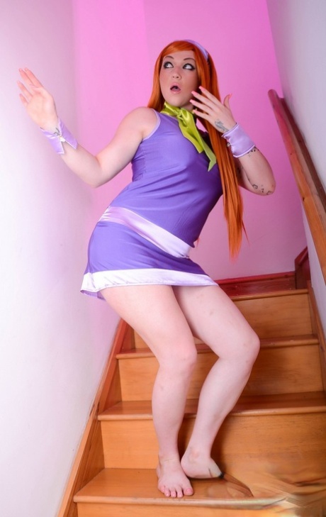 Redhead chick Harmony Reigns has sex on the stairs in a cosplay outfit