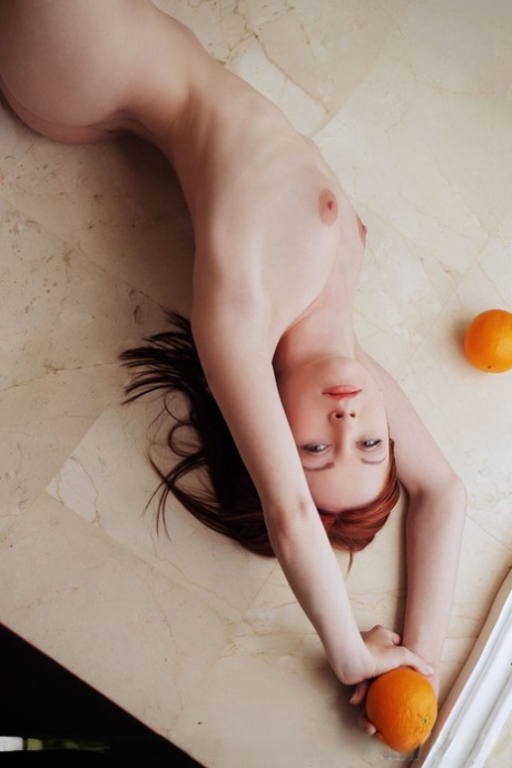 Pale redhead Night A in lace lingerie spreading long legs in bald twat closeup