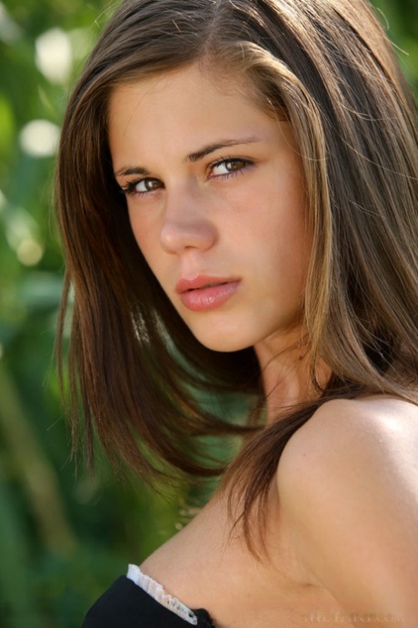 Young beauty Caprice A gets completely naked while in a cornfield