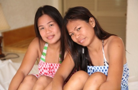 Filipina girls takes off summer dresses and underwear to stand naked together