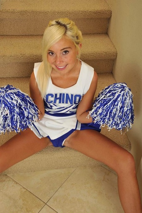 Blonde cheerleader Kaylee Hayee sets her tan lined body free on stairs