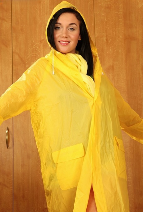 Sexy brunette Kety takes off her rainwear before masturbating in rubber boots