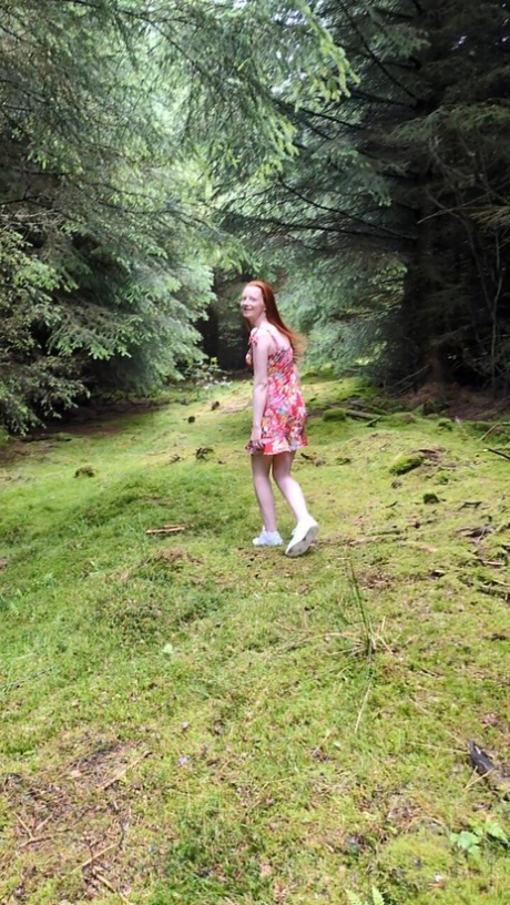 OnlyFans teen Redhead Shannen strips in the forest and shows her big booty