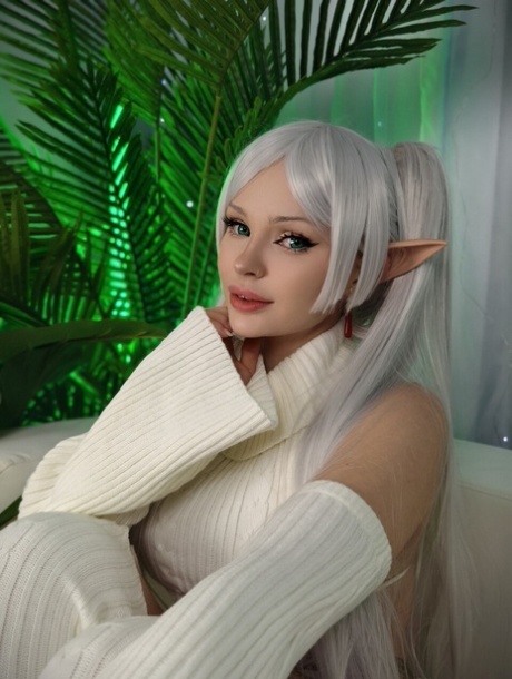 Platinum blonde chick Sonya Vibe sticks out her tongue while sporting elf ears
