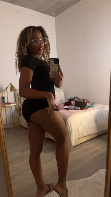 Curly haired ebony hottie Sky Alexxxis teases with her big ass & natural tits