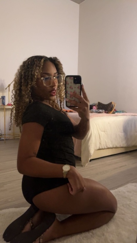 Curly haired ebony hottie Sky Alexxxis teases with her big ass & natural tits