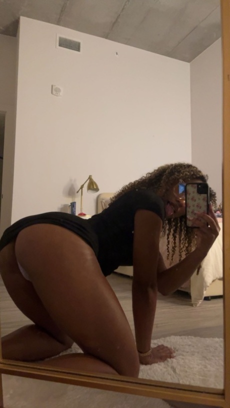 Curly haired ebony hottie Sky Alexxxis teases with her big ass & natural tits