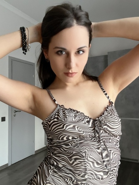 OnllyFans teen Alina Berryy posing in her sexy tight dress in a solo