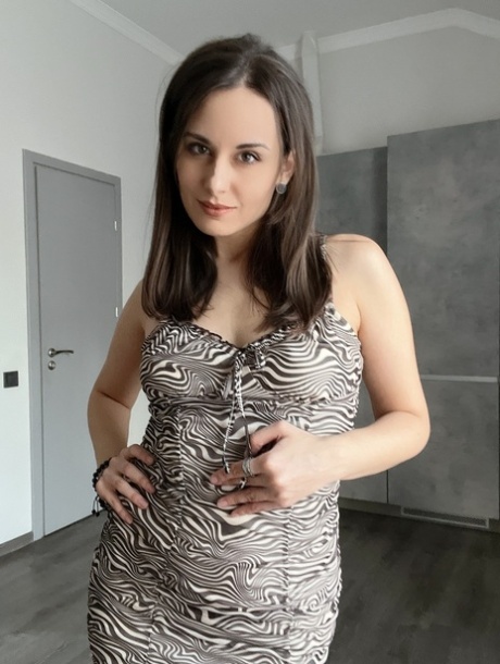 OnllyFans teen Alina Berryy posing in her sexy tight dress in a solo