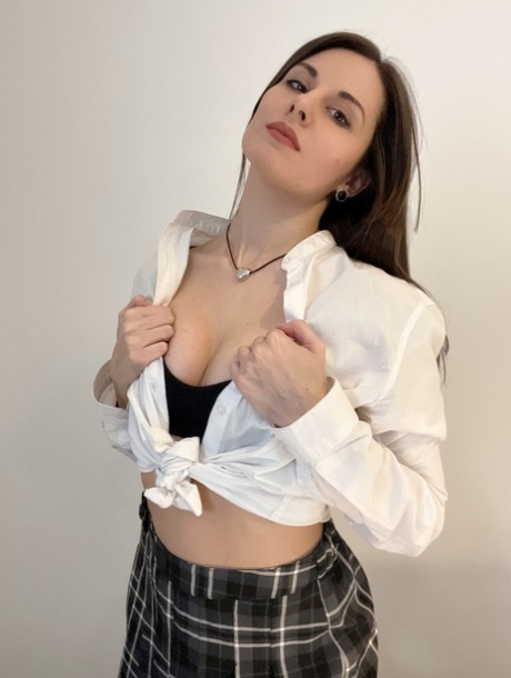 Sexy brunette teen Alina Berryy teases with her cleavage and big booty