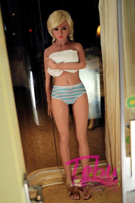 Blonde teen sex doll Deborah flaunts her lovely body and big juggs