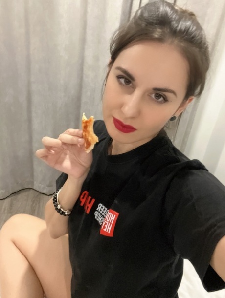 Sexy babe Alina Berryy shows her sweet small tits while eating a pizza