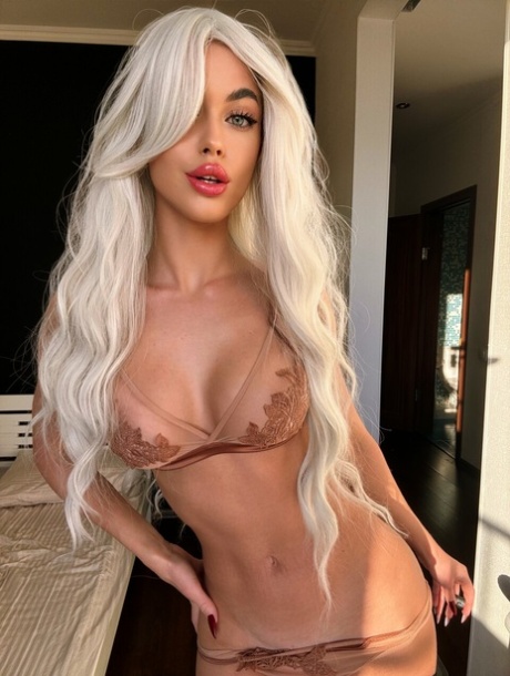 Hot platinum blonde X Ariana Witch X purses her lips during a glamour shoot