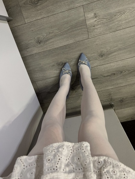 Caucasian female Sofi Foxxxy changes her hosiery while wearing high heels