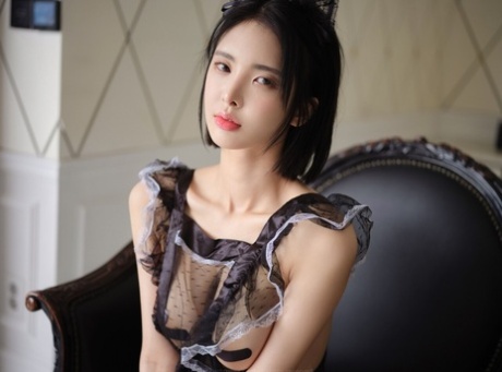 Sexy Korean babe teases with her body in a seductive sheer maid uniform