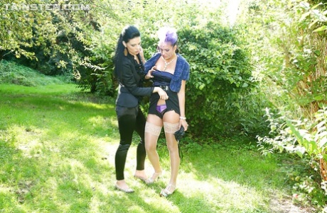 Partly clothed fetish vixens have some pissing and pussy toying fun outdoor