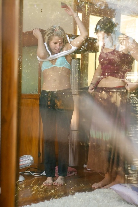 A Peeping Tom stands outside bedroom window while two girls get dressed - pornpics.de
