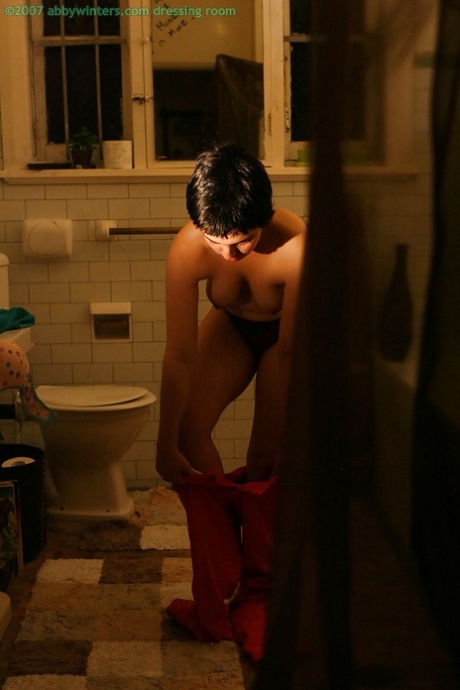 Hidden camera films short haired girl getting dressed after taking bath - pornpics.de