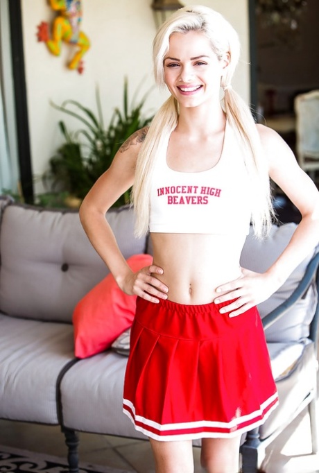 Blonde teen Elsa Dream hiking cheerleader uniform to flash shaved cunt