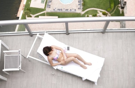 Brunette teen Kylie Quinn caught masturbating on balcony by voyeur - pornpics.de