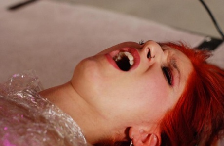 Flaming redhead is wrapped in saran wrap and forced to perform oral sex acts - pornpics.de