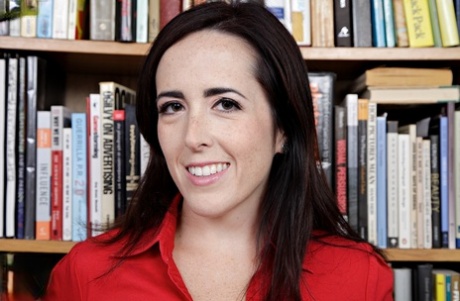 Brunette librarian uncovers her tiny tits as she strips between book stacks